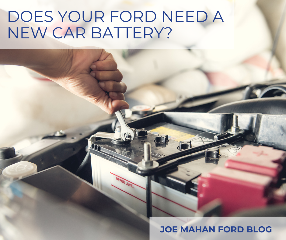 A photo of a car battery being replaced and the text: Does Your Ford Need a New Car Battery?