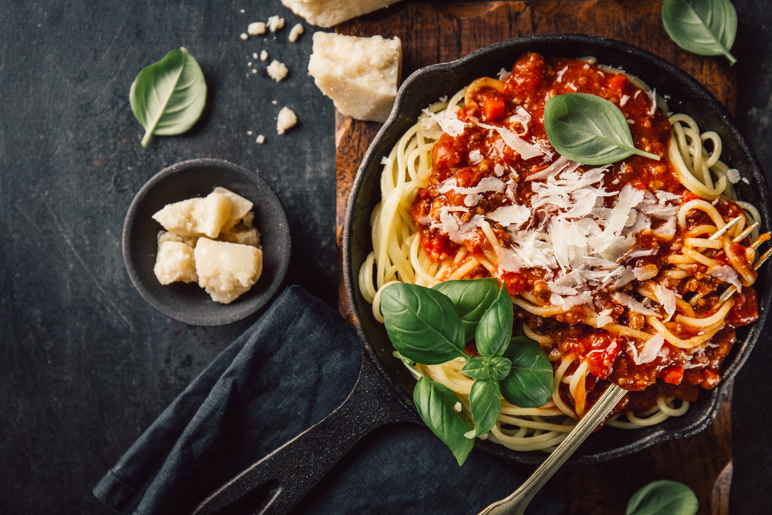 A plate of pasta and parmesan cheese.